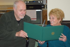 Tommy Lee has been named the 2016 Honorary Chair of Honor our KIA. Tommy, and his wife Pat, look over his US Army retirement certificate.